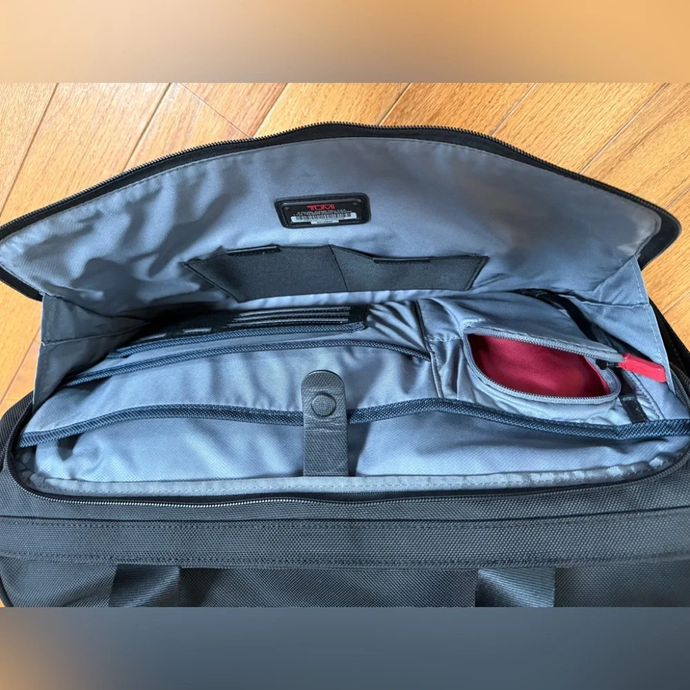 Tumi Black Duffel Bag with Adjustable Shoulder Strap